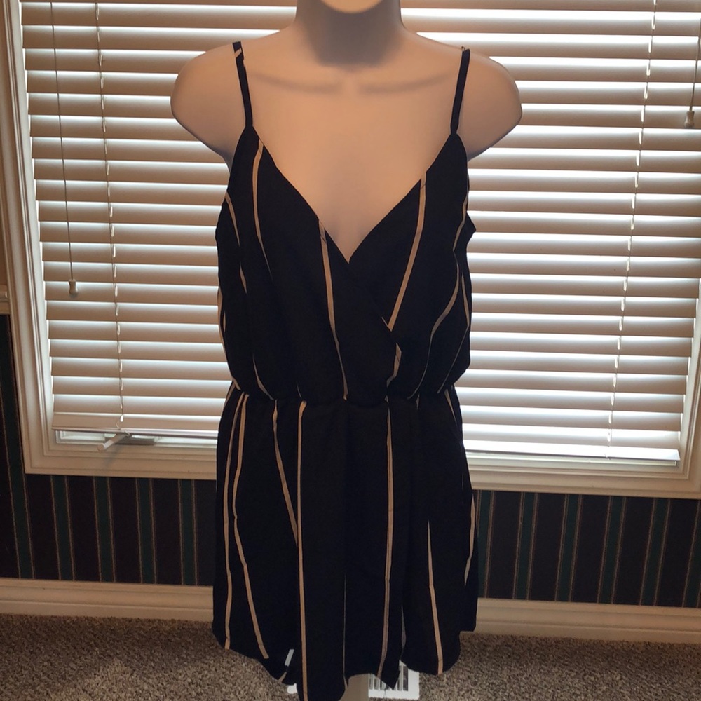Navy blue romper with vertical white stripes